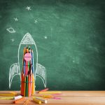 Start School Concept - Rocket Drawn On Blackboard