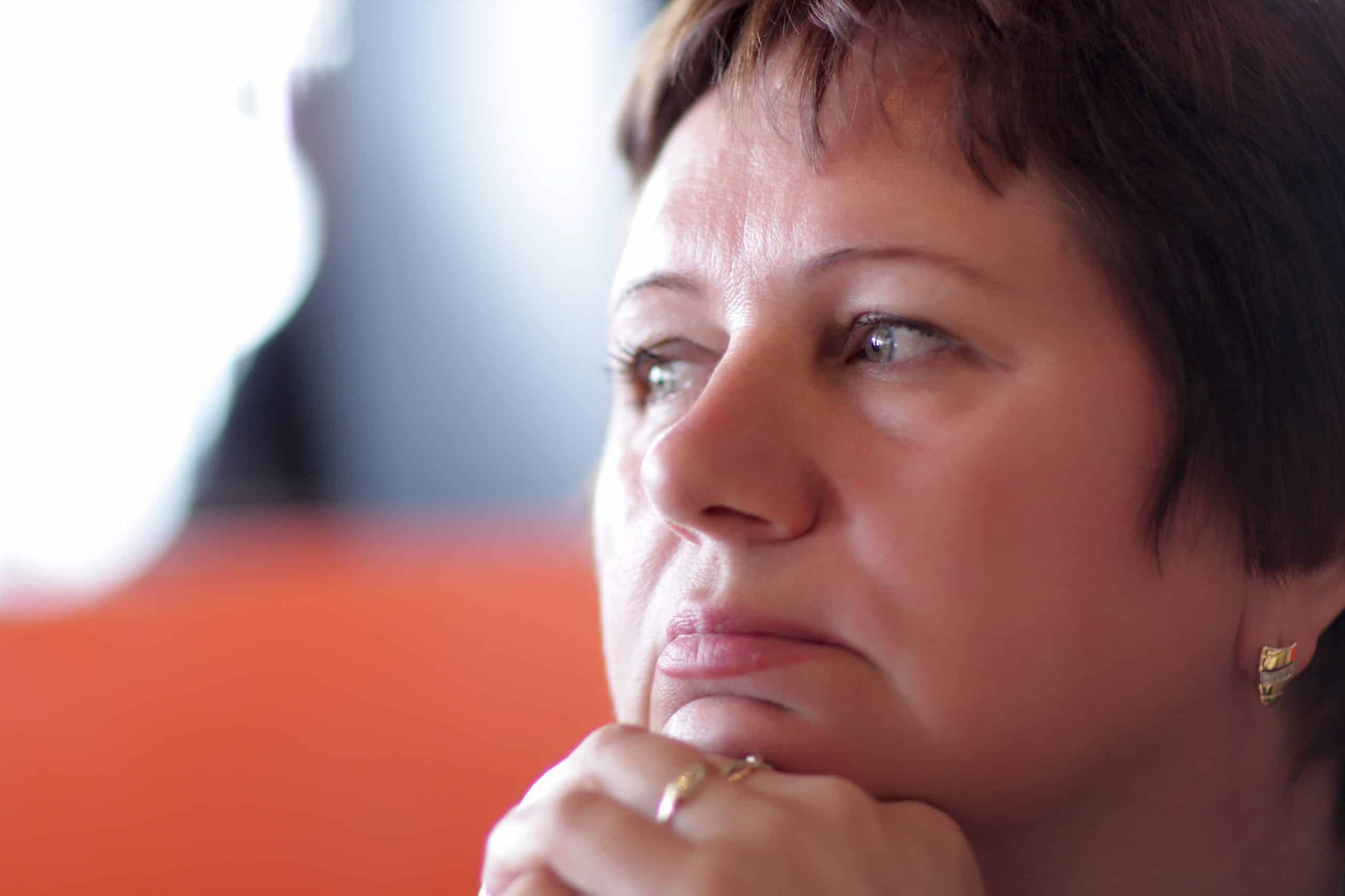 It is portrait of pensive mature woman indoor